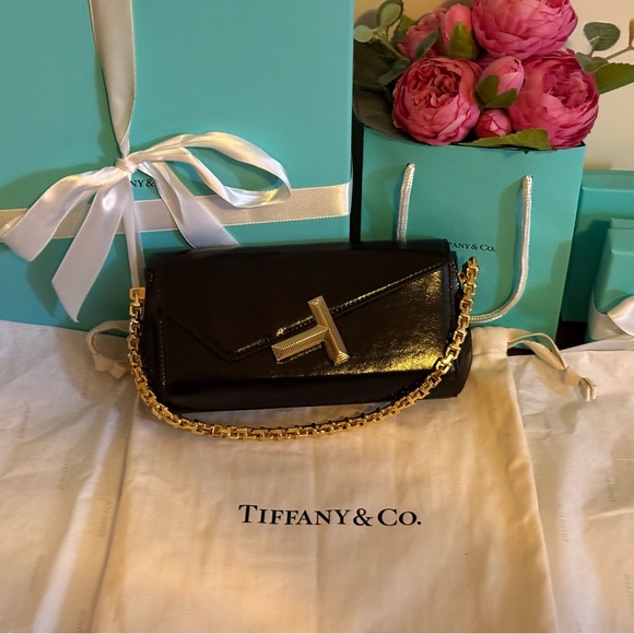Tiffany & Co. Handbags - Tiffany & Co. Shiny Mini Black Clutch with Gold Chain